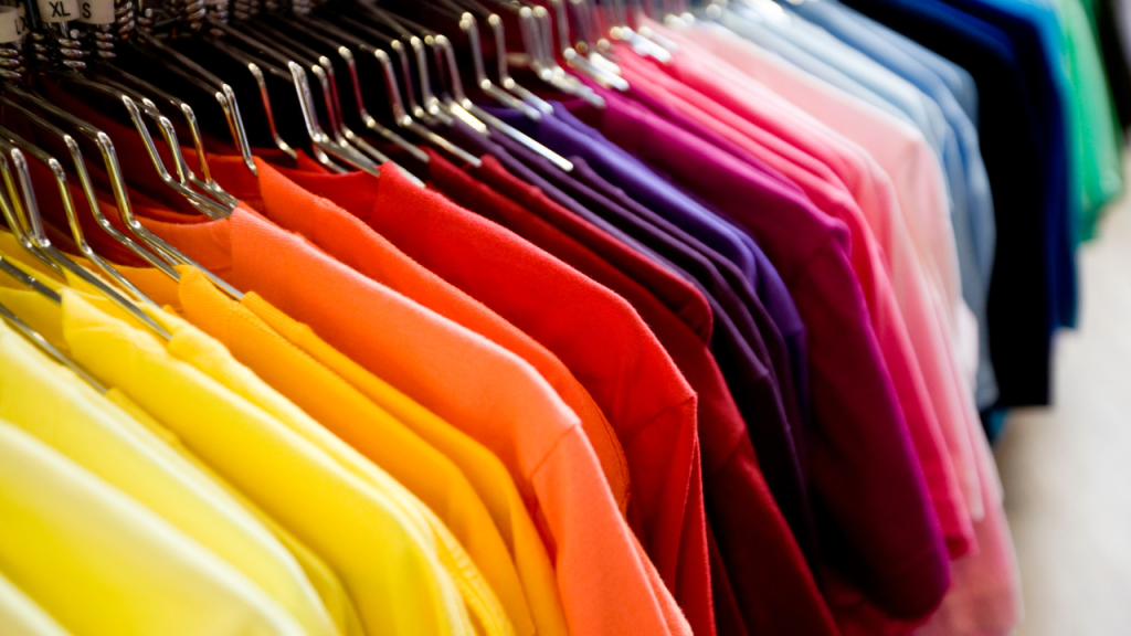 a row of colorful t-shirts