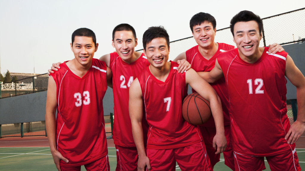 basketball players wearing red jersey