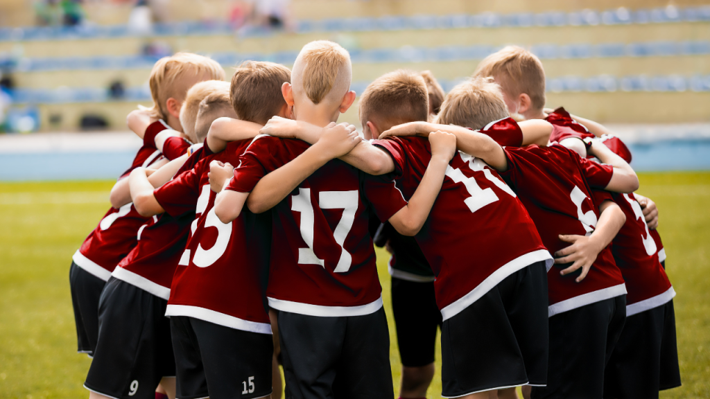 soccer players in a huddle