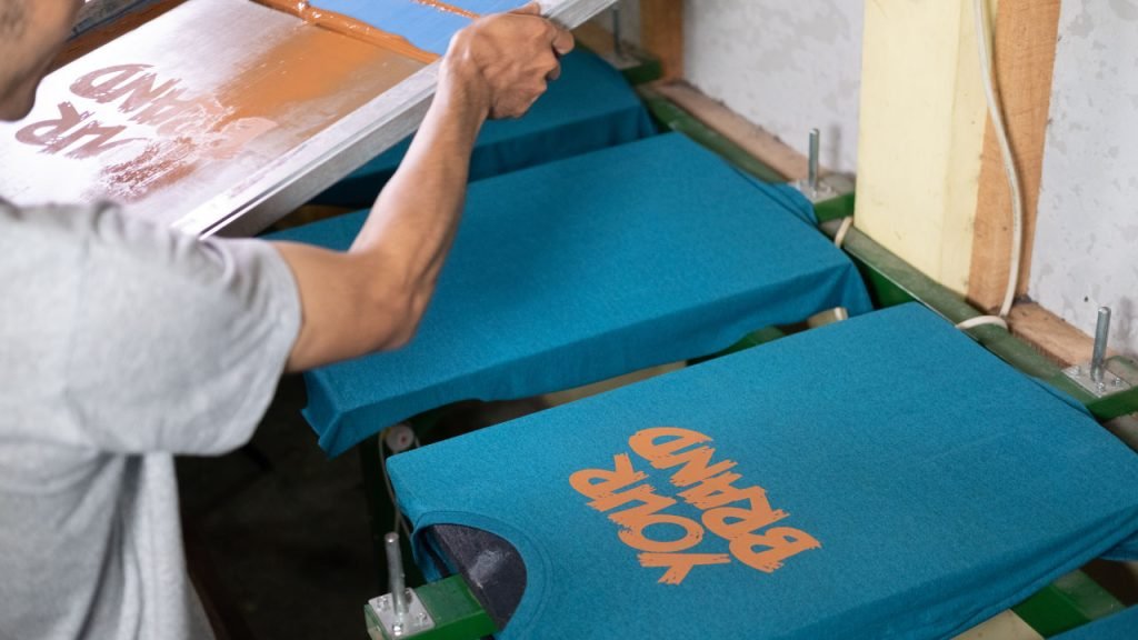 A man performing re-using the same design stencil.