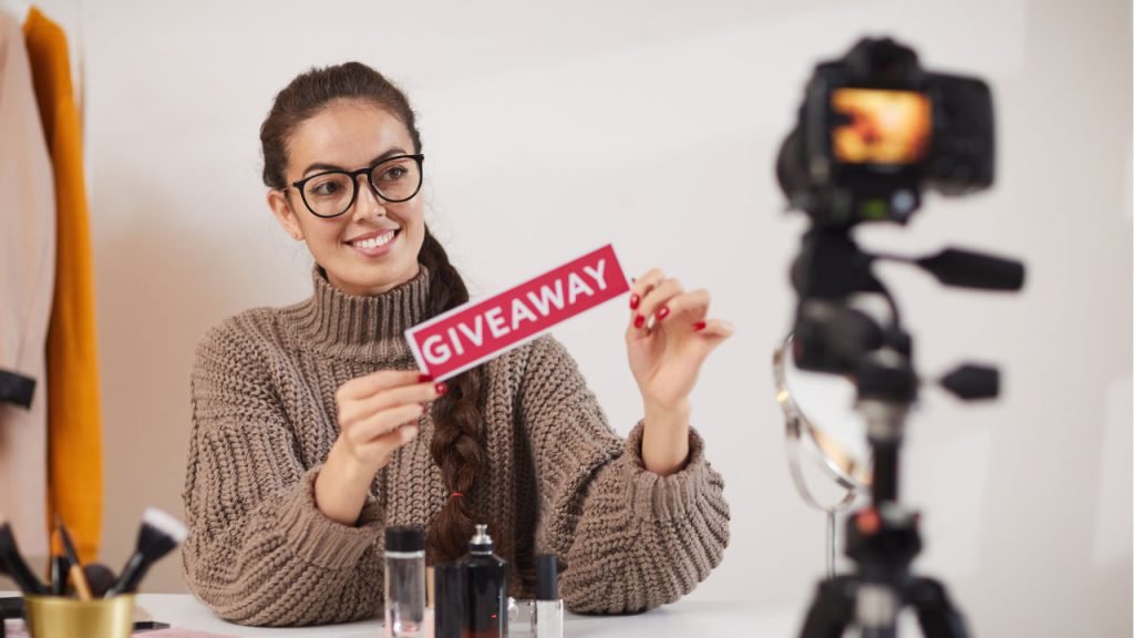 woman holding a giveaway text